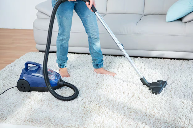 woman using vacuum cleaner carpet 13339 119343
