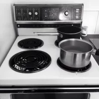 high-angle-view-containers-stove-kitchen-home_1048944-17528774
